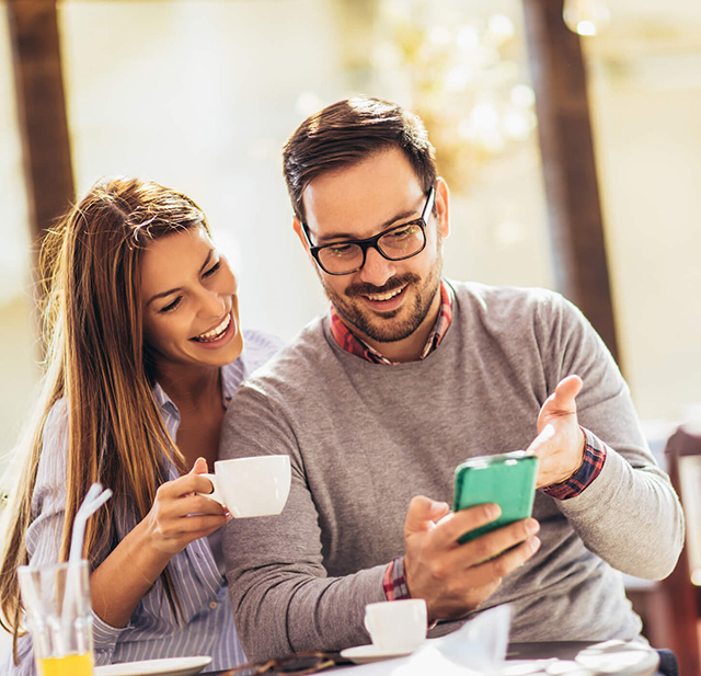 A couple transferring money online.