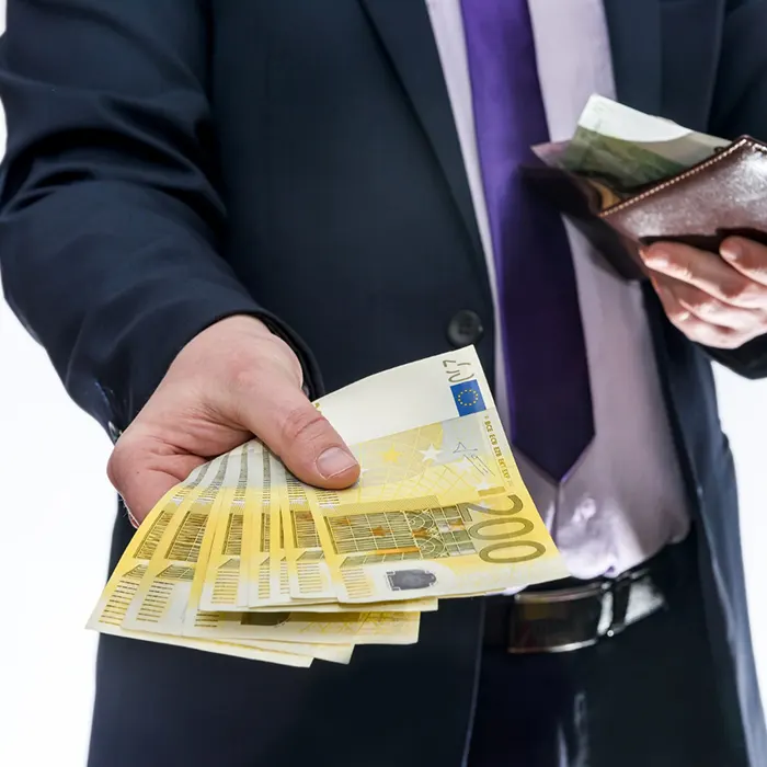 a Man holding wallet and offering euro foreign currency