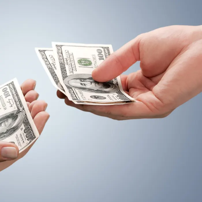a lady holding foreign currency dollar